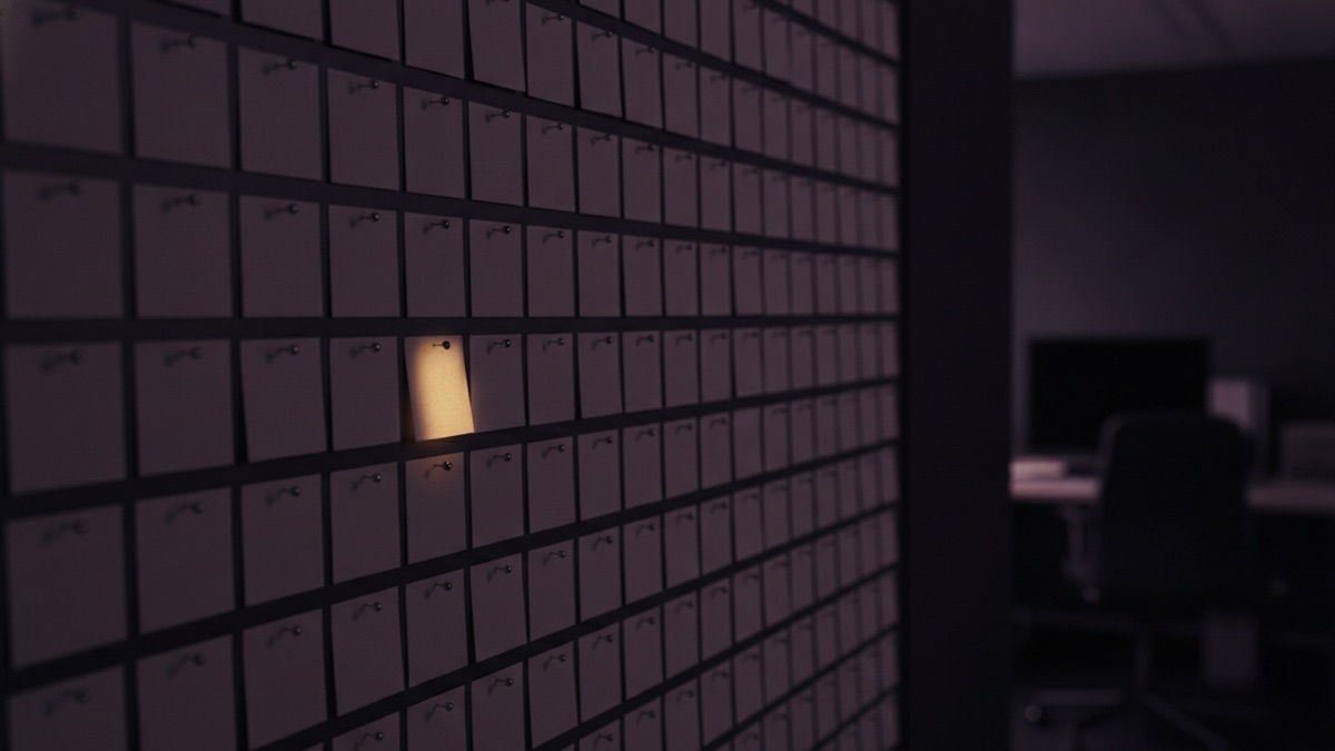 A grid of index cards pinned to a dark wall, a single card caught in the light
