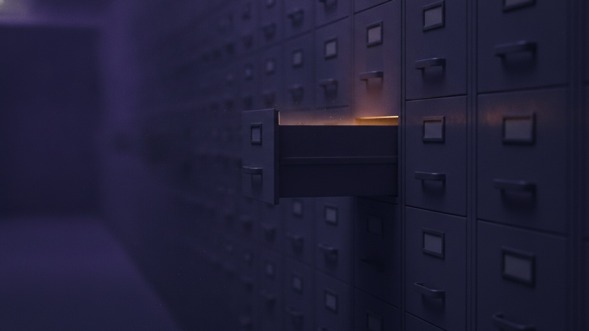 A wall of archive filing drawers with a single drawer pulled open